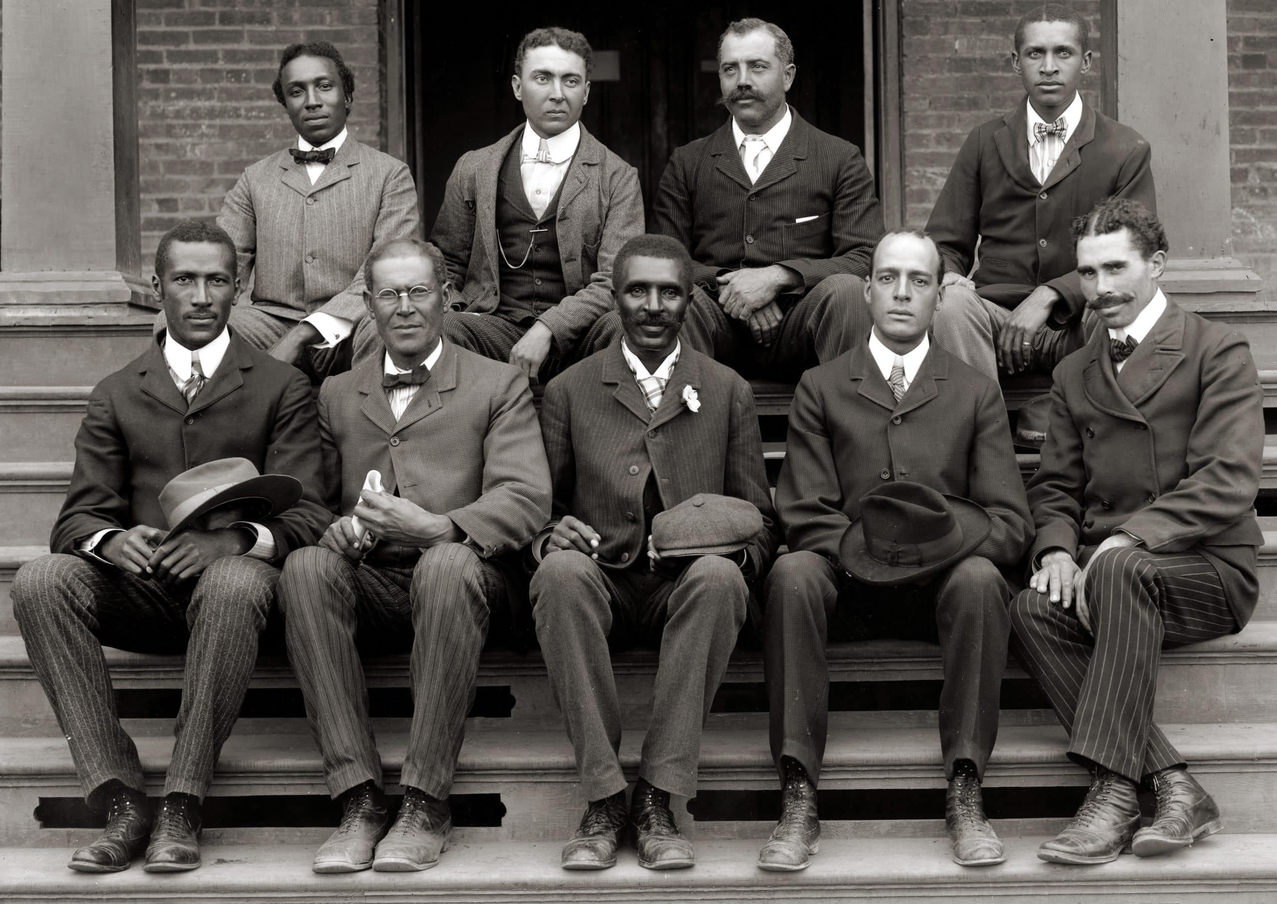 George Washington Carver (front row, center) poses with fellow faculty of Tuskegee Institute.
